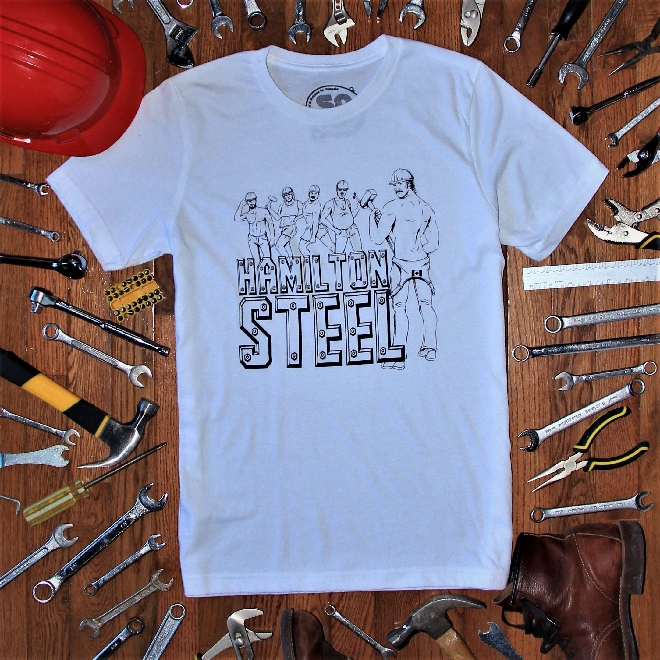 HAMILTON STEEL TEE - BLACK - white t-shirt with black text reading 'HAMILTON STEEL' with illustration of 5 men with hard hats and no shirts